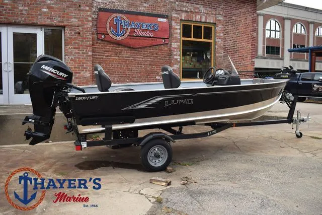 Slide: The Image of 2024 Lund 1600 Fury SS boat on trailer at Thayer's Marine dealership. - 3