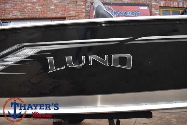 Slide: The Image of 2024 Lund 1600 Fury SS boat side view with logo at Thayer's Marine. - 4