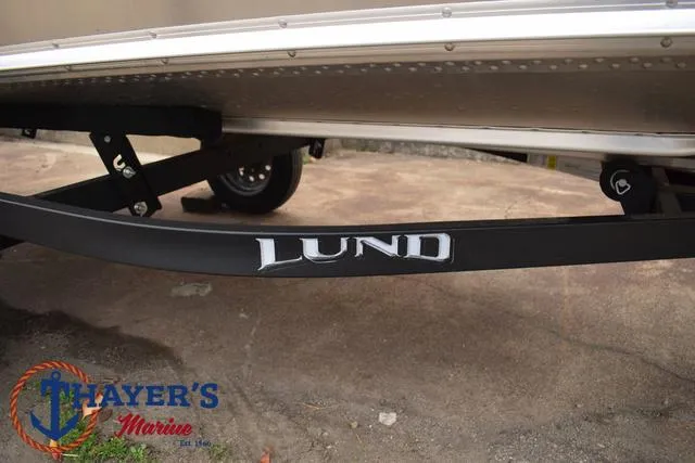 Slide: The Image of 2024 Lund 1600 Fury SS boat trailer with Thayer's Marine logo. - 7