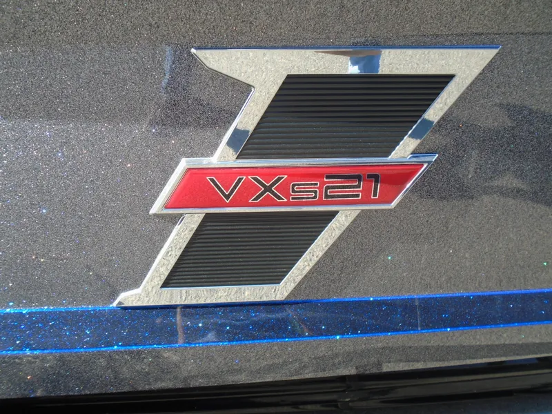 Slide: The Image of 2025 Vexus VX21 logo on metallic surface with blue accents. - 10