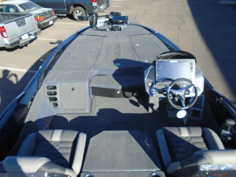 Slide: The Image of 2025 Vexus VX21 boat interior with steering console and seating. - 4