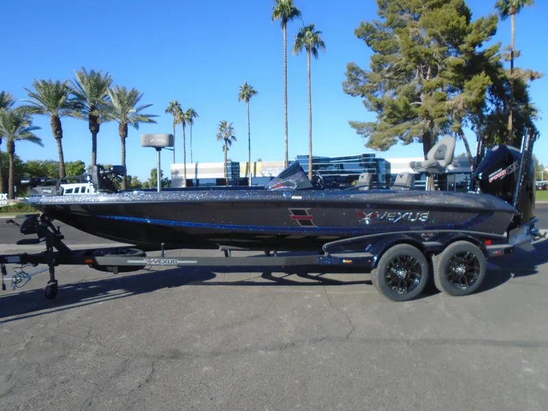 Slide: The Image of 2025 Vexus VX21 boat on trailer, parked outdoors with palm trees in the background. - 6