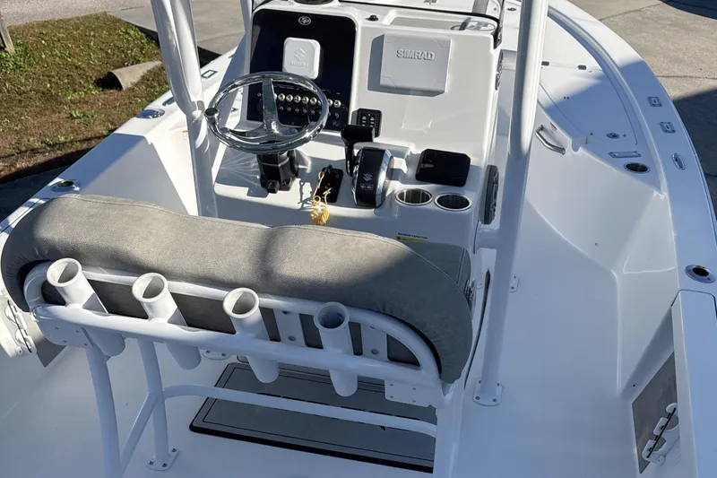 Slide: The Image of 2023 Sea Pro 228 Bay boat interior with steering console and seating. - 15