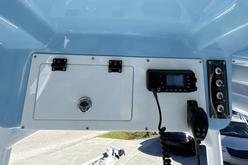 Slide: The Image of 2023 Sea Pro 228 Bay boat console with radio and storage compartment. - 18