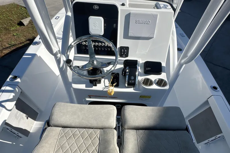 Slide: The Image of 2023 Sea Pro 228 Bay boat console with steering wheel and controls. - 20