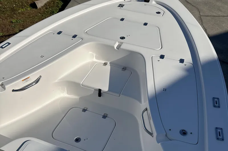 Slide: The Image of 2023 Sea Pro 228 Bay boat deck with storage compartments. - 7