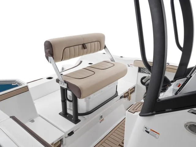 Slide: The Image of 2025 Yamaha Boats 222 FSH Sport E interior with beige seating and sleek design. - 11