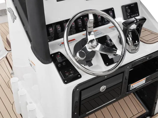 Slide: The Image of 2025 Yamaha Boats 222 FSH Sport E dashboard with steering wheel and controls. - 20