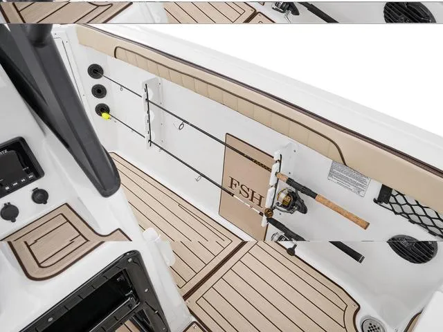 Slide: The Image of 2025 Yamaha Boats 222 FSH Sport E interior with rod holders and sleek design. - 4