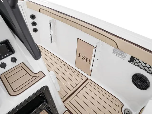 Slide: The Image of 2025 Yamaha Boats 222 FSH Sport E interior with tan and white detailing. - 5