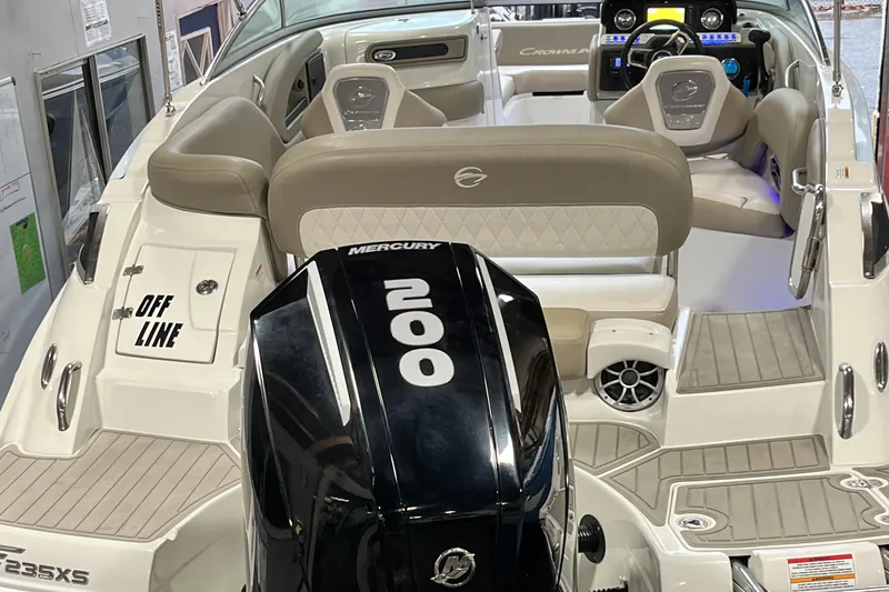 Slide: The Image of 2023 Crownline Eclipse E235 XS boat interior with Mercury 200 engine. - 20