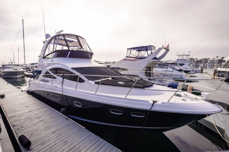 Slide: The Image of 2012 Sea Ray 450 Sedan yacht docked at marina. - 0