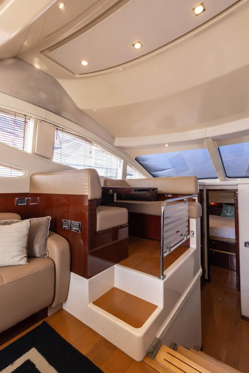 Slide: The Image of Luxurious interior of 2012 Sea Ray 450 Sedan yacht with elegant seating and modern design. - 10