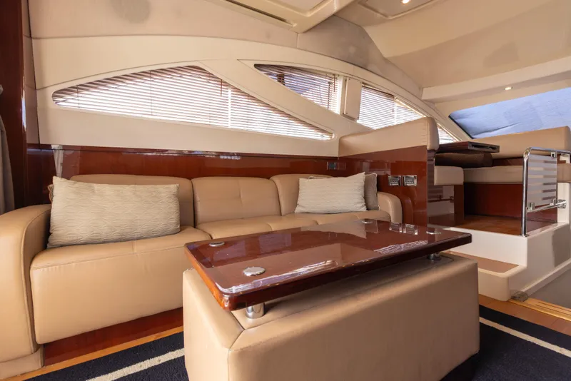 Slide: The Image of Luxurious interior of 2012 Sea Ray 450 Sedan yacht with beige leather seating. - 14