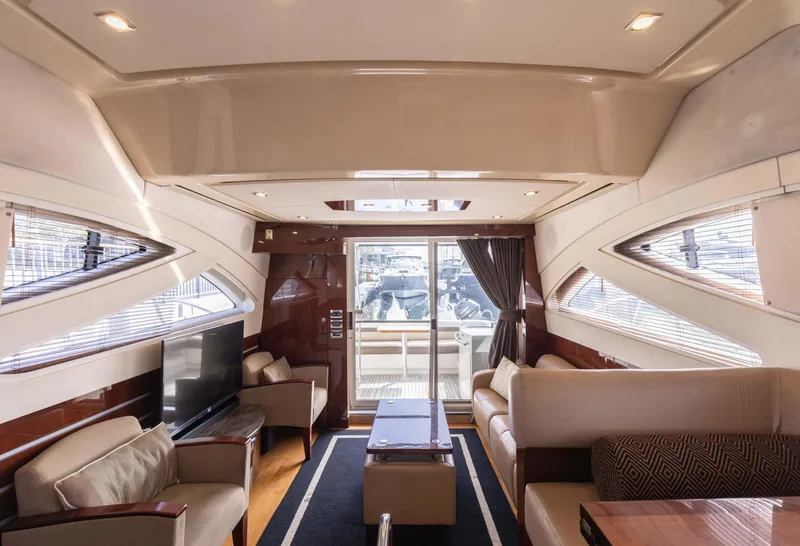 Slide: The Image of Luxurious interior of 2012 Sea Ray 450 Sedan yacht with elegant seating and modern design. - 15
