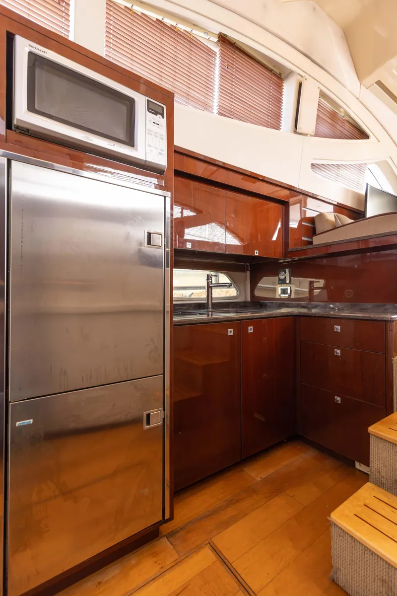 Slide: The Image of Luxurious kitchen interior of 2012 Sea Ray 450 Sedan yacht with modern appliances. - 16