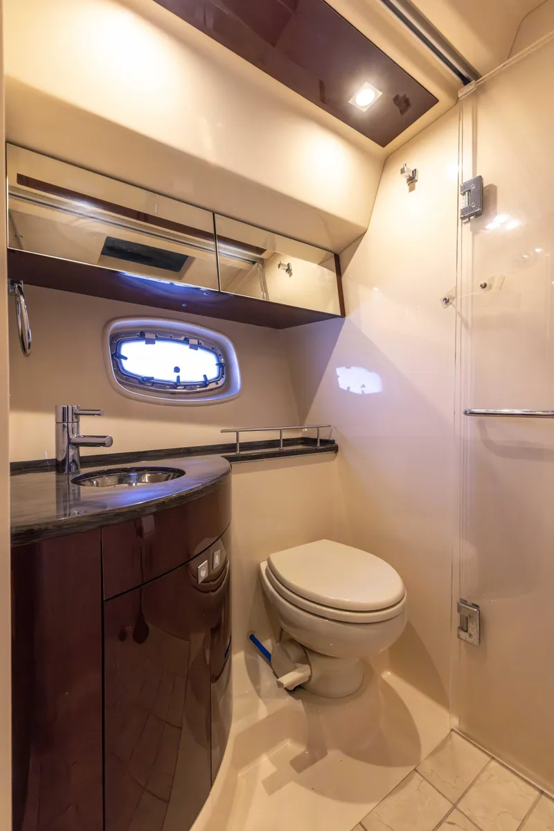 Slide: The Image of Luxurious bathroom in 2012 Sea Ray 450 Sedan yacht with modern fixtures. - 21