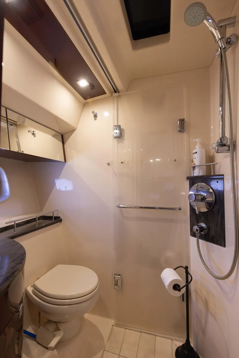 Slide: The Image of Luxurious bathroom in 2012 Sea Ray 450 Sedan yacht with shower and toilet. - 22