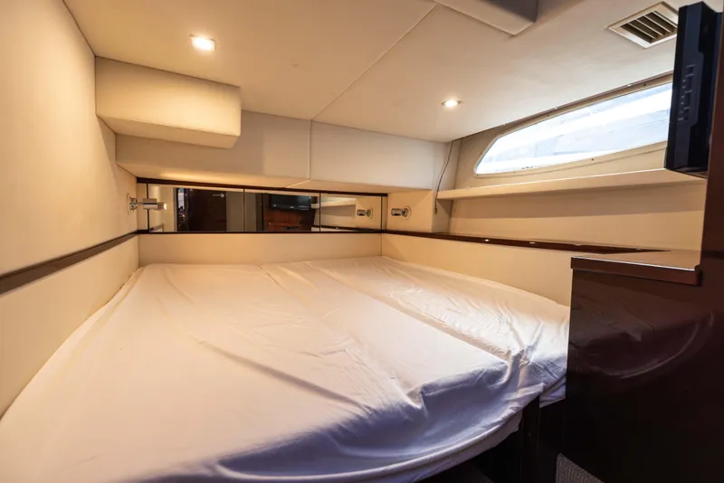 Slide: The Image of Luxurious cabin interior of 2012 Sea Ray 450 Sedan yacht with cozy bed. - 23