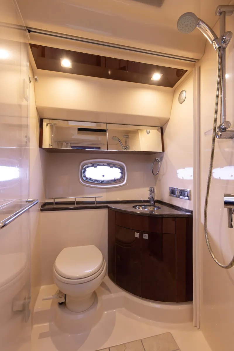 Slide: The Image of Luxurious bathroom in 2012 Sea Ray 450 Sedan yacht with modern fixtures. - 26