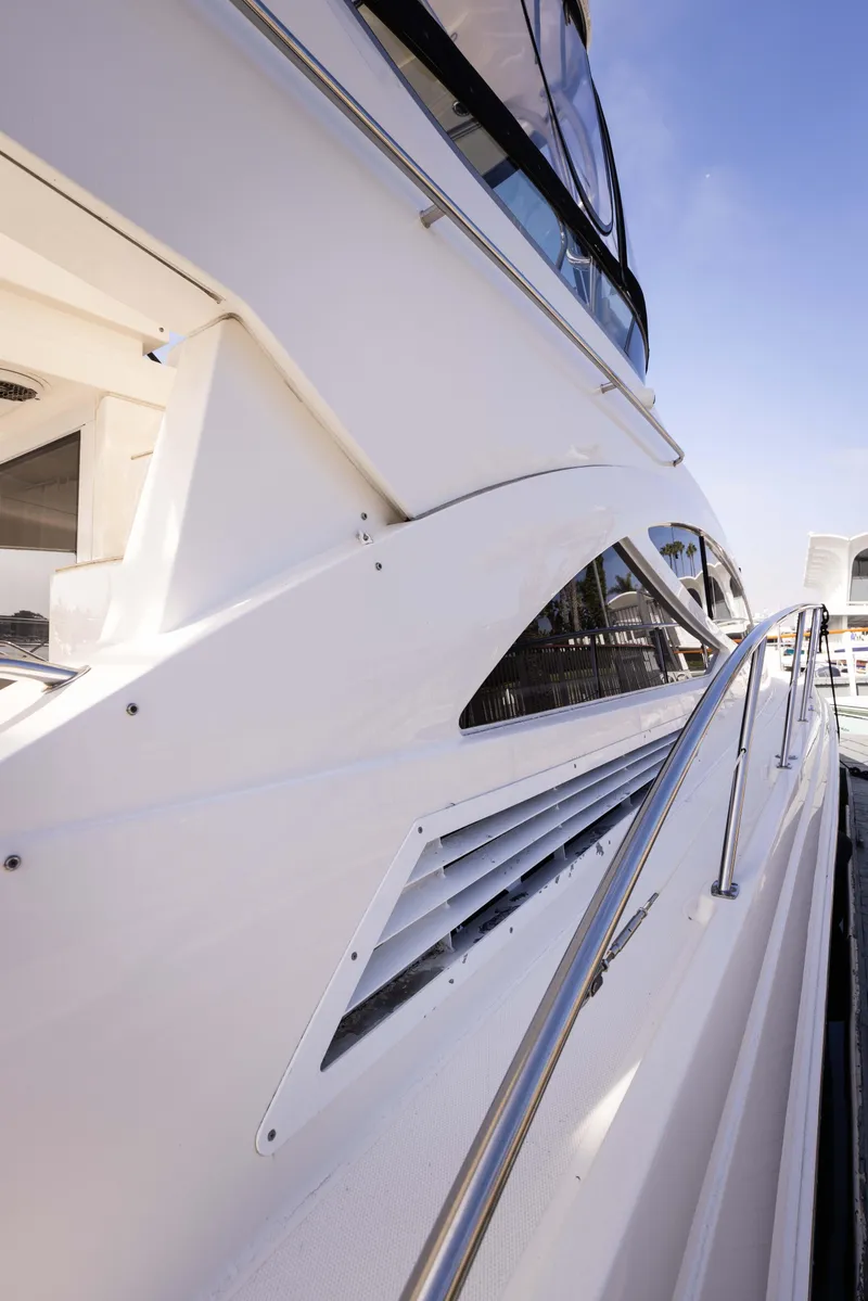 Slide: The Image of Side view of 2012 Sea Ray 450 Sedan yacht with sleek design. - 28