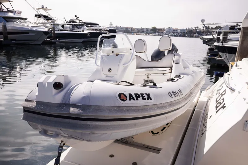 Slide: The Image of Apex inflatable boat docked near 2012 Sea Ray 450 Sedan yacht. - 29