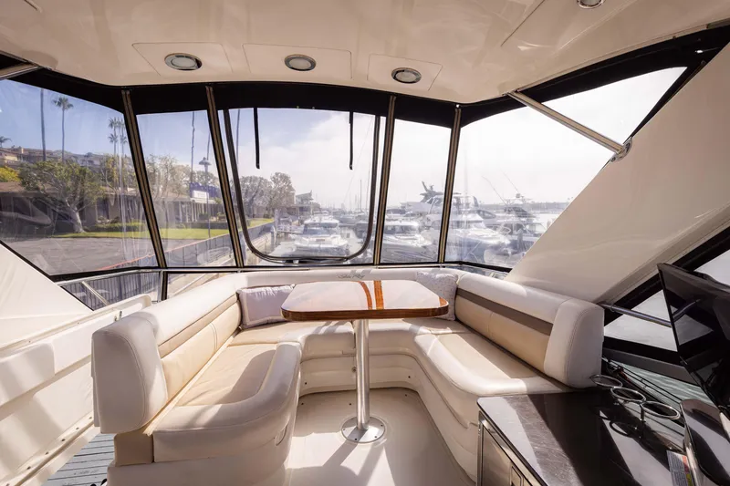 Slide: The Image of Luxurious interior of 2012 Sea Ray 450 Sedan yacht with panoramic windows and plush seating. - 7