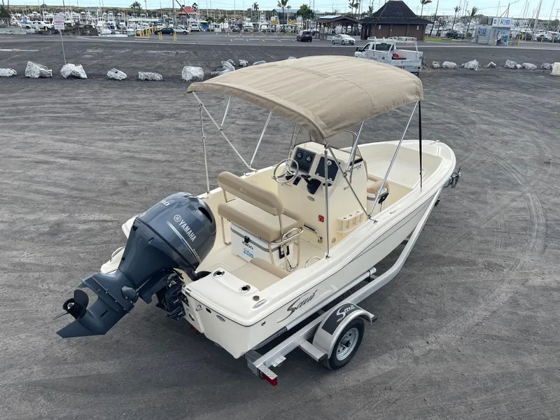 Slide: The Image of 2024 Scout 175 Sportfish boat with Yamaha outboard engine on a trailer. - 7