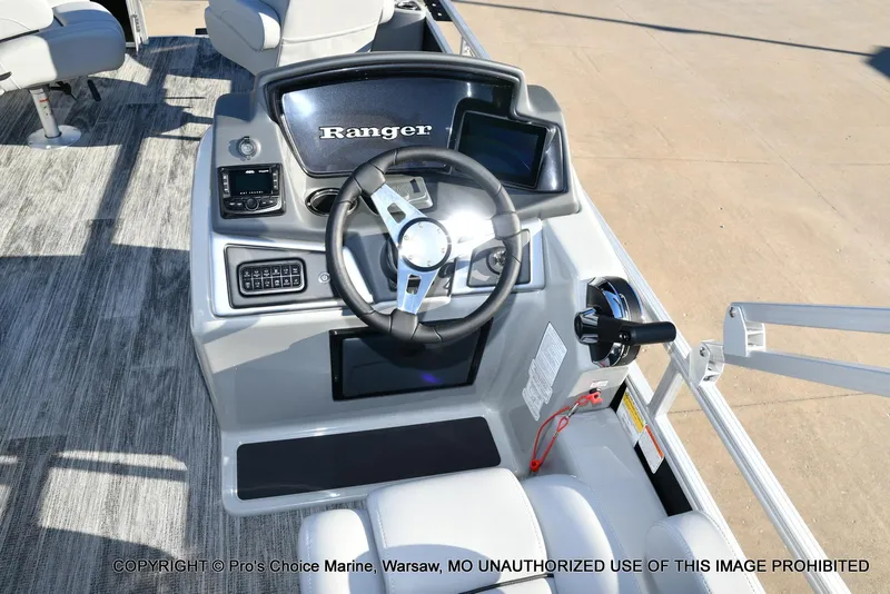 Slide: The Image of 2024 Ranger 220F boat console with steering wheel and controls, featuring Mercury 150HP engine. - 10