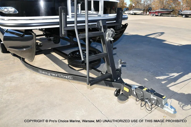 Slide: The Image of 2024 Ranger 220F boat trailer with 150HP Mercury 4 Stroke engine, parked outdoors. - 22
