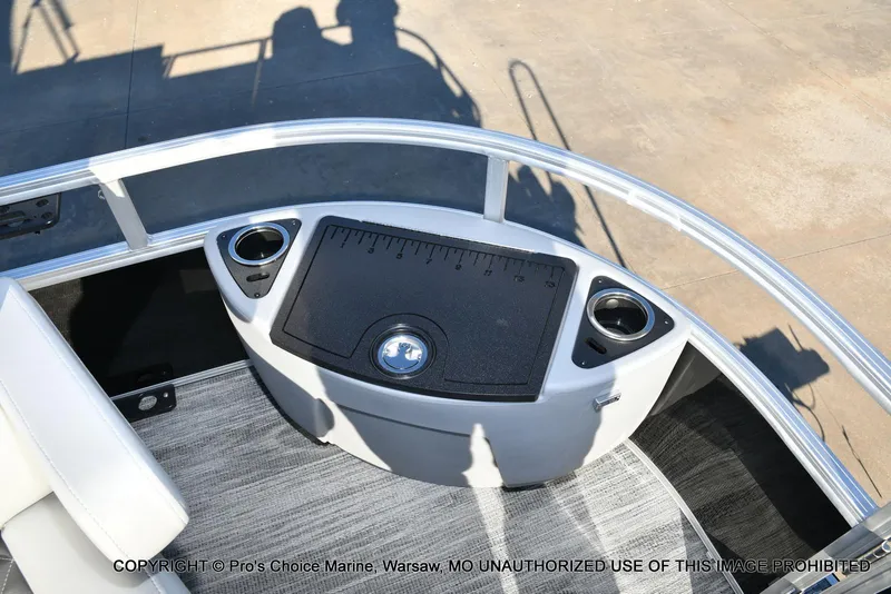 Slide: The Image of 2024 Ranger 220F boat deck with cup holders and storage compartment. - 26