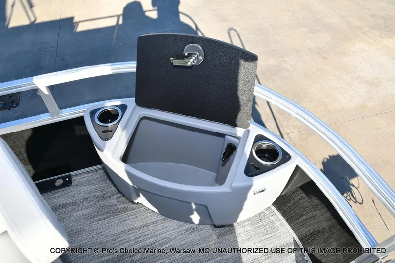 Slide: The Image of 2024 Ranger 220F boat interior with storage compartment and cup holders. - 27