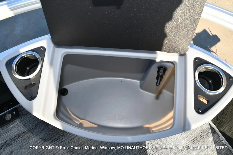 Slide: The Image of 2024 Ranger 220F boat storage compartment with cup holders and Mercury 150HP engine. - 28