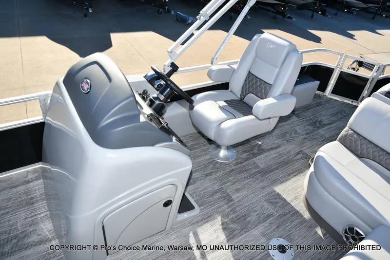 Slide: The Image of 2024 Ranger 220F boat interior with steering console and plush seating. - 37