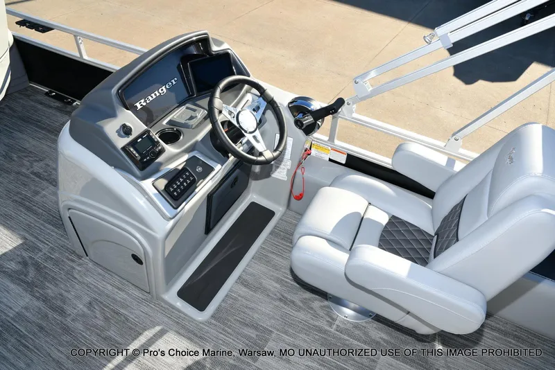 Slide: The Image of 2024 Ranger 220F boat interior with steering console and comfortable seating. - 40