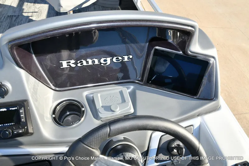 Slide: The Image of 2024 Ranger 220F boat dashboard with controls and display screen. - 44