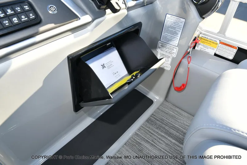 Slide: The Image of 2024 Ranger 220F boat interior with glove compartment and safety instructions. - 45