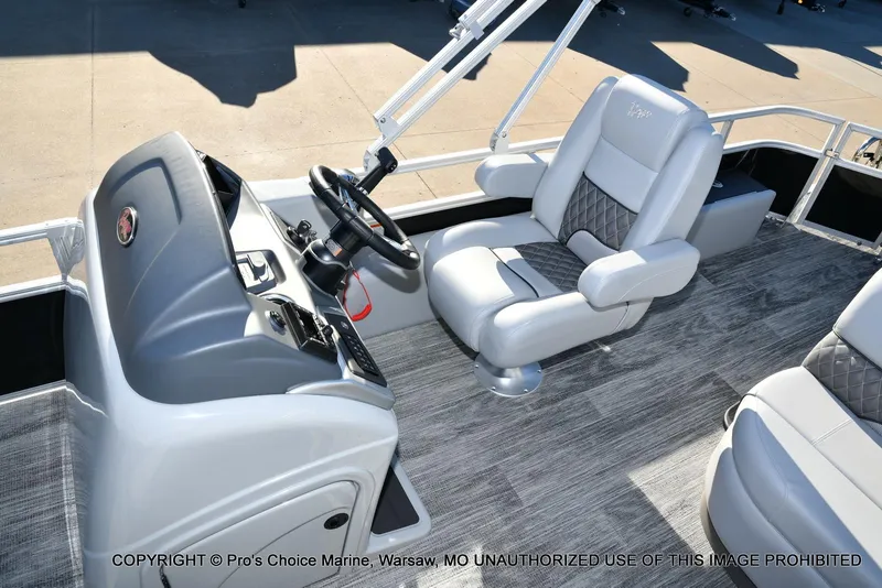 Slide: The Image of 2024 Ranger 220F boat interior with steering console and plush seating. - 7