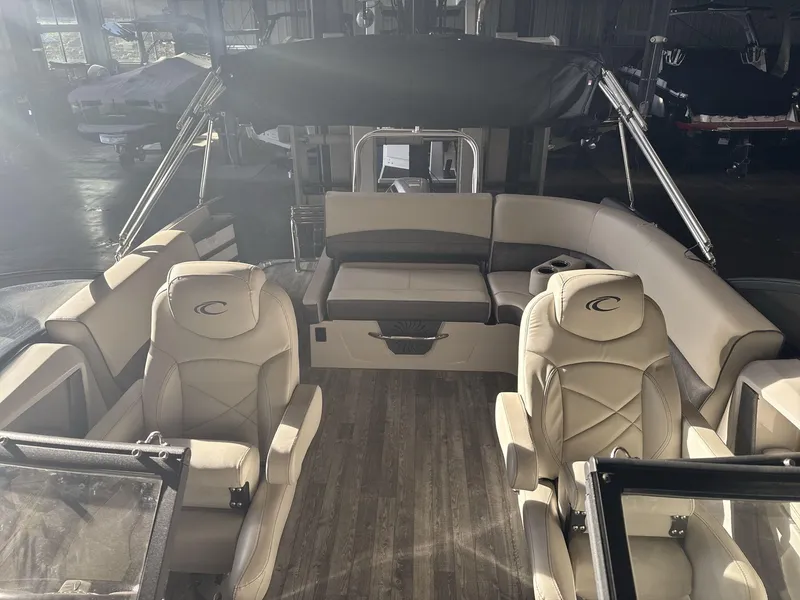 Slide: The Image of Interior of 2018 Crest Continental boat with beige seating and wood flooring. - 10