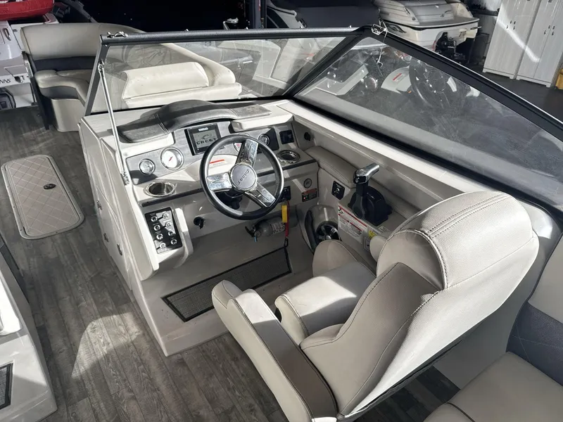 Slide: The Image of 2018 Crest Continental boat interior with steering wheel and dashboard controls. - 11