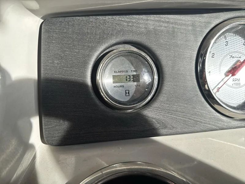 Slide: The Image of Close-up of 2018 Crest CONTINENTAL boat dashboard with elapsed time and RPM gauges. - 13