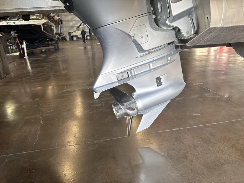 Slide: The Image of Close-up of a 2018 Crest CONTINENTAL boat motor in a garage setting. - 18