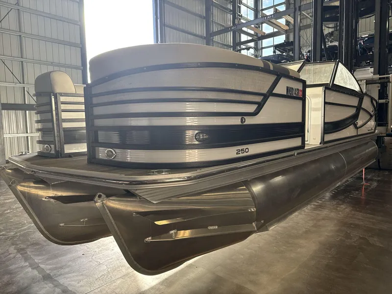 Slide: The Image of 2018 Crest Continental pontoon boat in storage facility. - 3