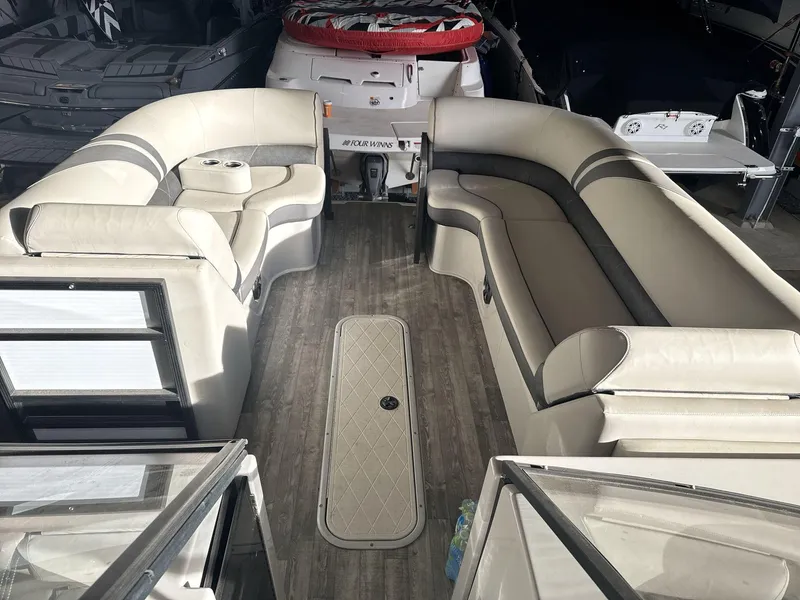 Slide: The Image of 2018 Crest Continental boat interior with spacious seating and modern design. - 8