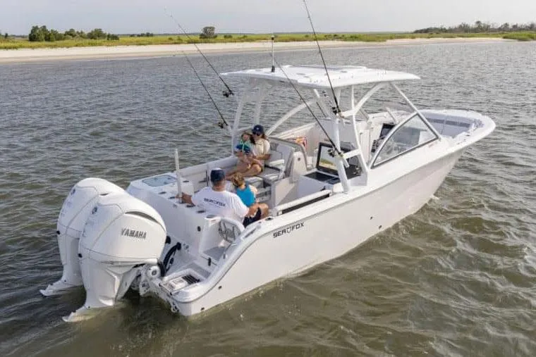 The Image of 2025 Sea Fox 288 Traveler boat displayed outdoors on stands. - 0