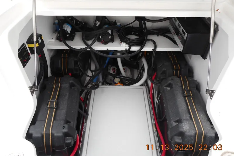 Slide: The Image of Electrical compartment of 2025 Sea Fox 288 Traveler boat, showing battery setup and wiring. - 16