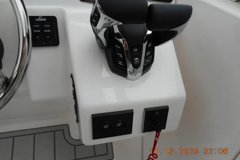 Slide: The Image of Control panel of 2025 Sea Fox 288 Traveler boat with steering wheel and throttle. - 19