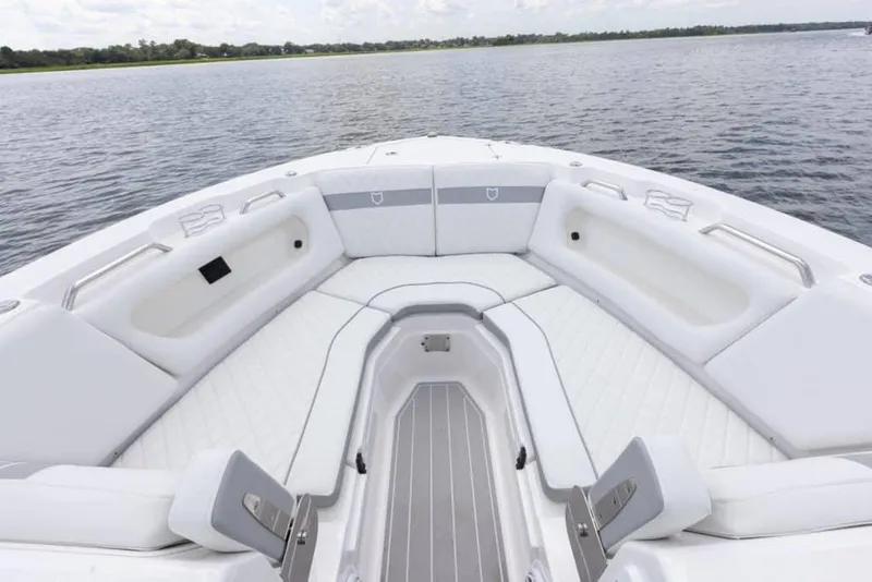 Slide: The Image of 2025 Sea Fox 288 Traveler boat with dual engines, docked under cloudy skies. - 3