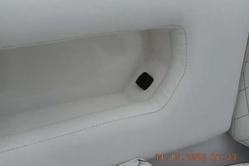 Slide: The Image of White interior detail of 2025 Sea Fox 288 Traveler boat, featuring stitching and a black component. - 32