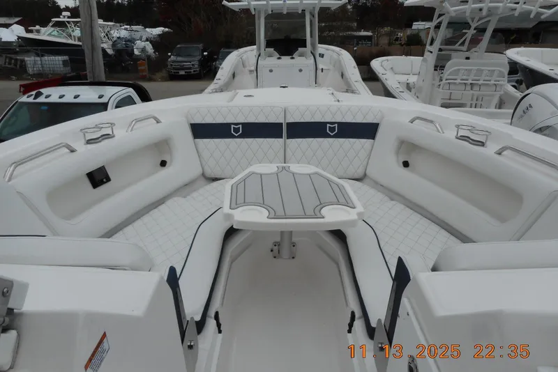 Slide: The Image of 2025 Sea Fox 288 Traveler boat interior with white seating and table. - 34